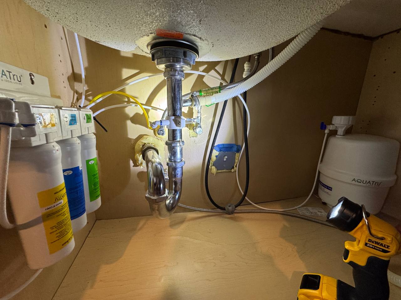 Under-sink plumbing and filtration installation